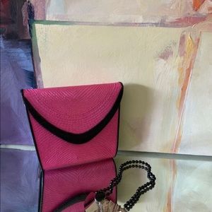 Straw clutch with faux leather trim
